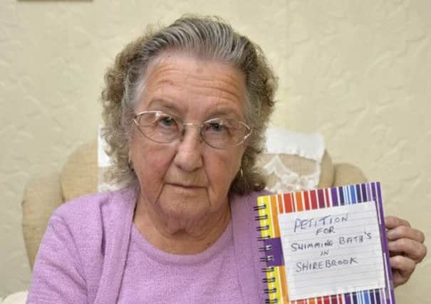 Shirebrook resident Nora Simons is petitioning for a swimming baths in the town, Nora is pictured with her petition