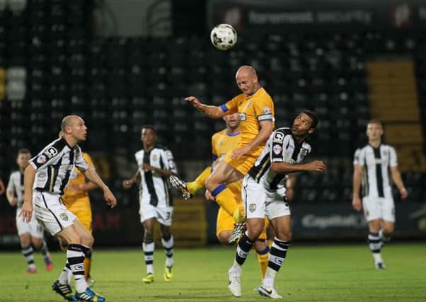 Adam Murray climbs highest for the Stags at Meadow Lane - Picture by Richard Parkes