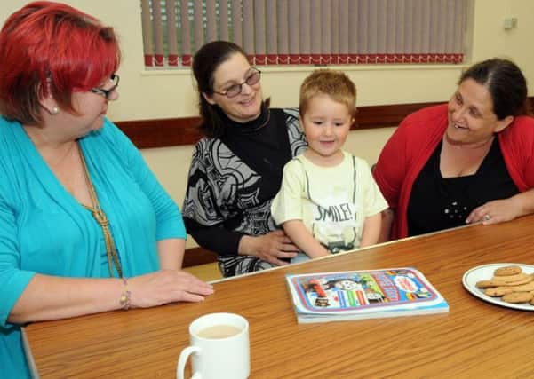 Pictured at a Supporting Parents in Crisis meeting at the Healdswood Community Centre on Friday evening are from left, Margaret Renshaw the group's treasurer, service user, Georgina Robertson and her son Alistair and Sheila Riley the group chairman.