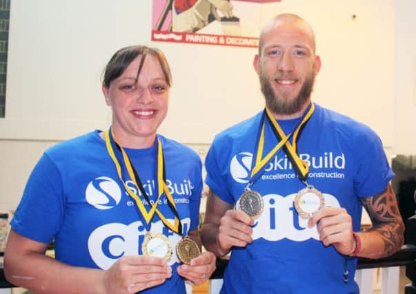 West Notts College students Anna Lodge and Frankie Hawson show off their gold and silver medals from the regional SkillBuild competitions.