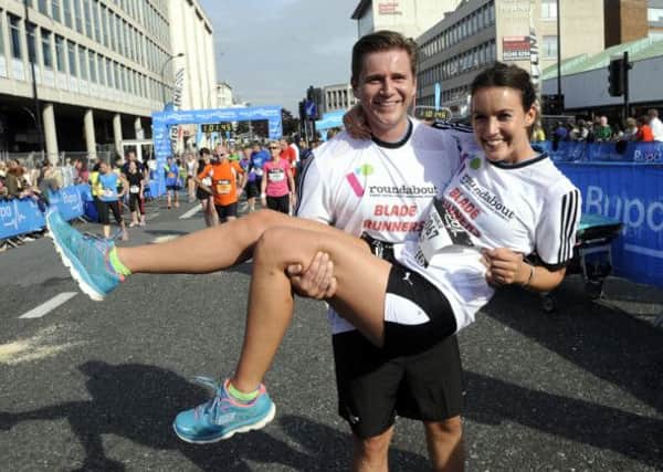 Downton Abbey star Allen Leech sweeps TV presenter girlfriend Charlie Webster off her feet after they finished together at the end of Sheffield's Bupa Great Yorkshire Run.
