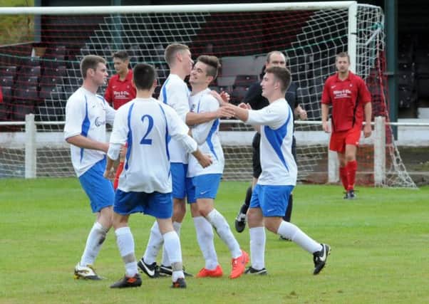 Blidworth Welfare (white and blue) v Clipstone in FA Vase action.  Blidworth celebrate their first half goal.