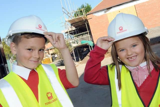 Pupils at the Forest Town Primary and Nursery School, Jack Tyler and Macie Kimberley tip their hats to the building of a new foundation unit at their School.