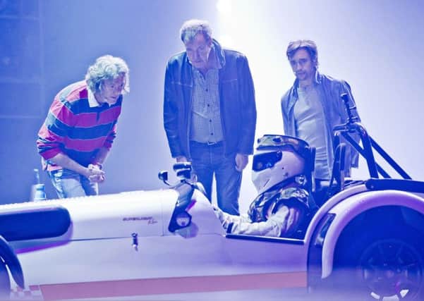 Clarkson, Hammond, May and the Stig will be returning in 2015 with their biggest ever stunt-studded Top Gear Live show. Photo: Alan Peebles