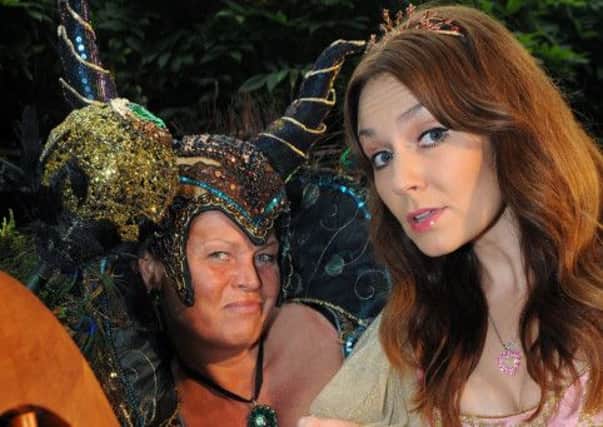Vicky Entwistle as Bad Fairy Carabosse eyes up her prey in the guise of Princess Briar Rose played by Amy Thompson.