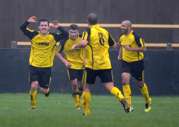 GOALCAM -- midfielder Cameron Davidson (left) leads the celebrations with teammates Aaron Evans, Nathan Robinson and Leon Aikman after putting Town in front against Blidworth.