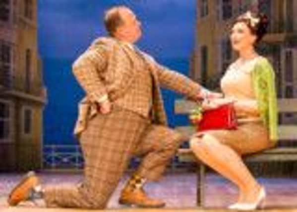Faint heart never wins fair lady as Francis Henshall (Gavin Spokes) attempts to woo Dolly (Emma Barton from 'EastEnders') in this scene from 'One Man, Two Guvnors' at Nottingham Theatre Royal.