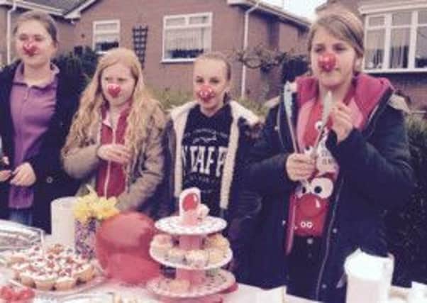 Kira-J Griffin with Georgia Waldram, Alicia Stocks and  Millie Brooks at their bake sale for Comic Relief.