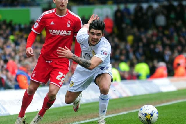 Alex Mowatt takes on Forest player Gary Gardner.