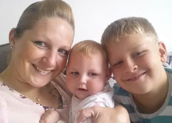 Michelle Carr  wih 15-month-old daughter Evalyn and son Daniel, 10. Michelle and husband Jonathan are raising money to buy a hydrotherapy pool for Evalyn wh suffers from a debilitating bain disease.