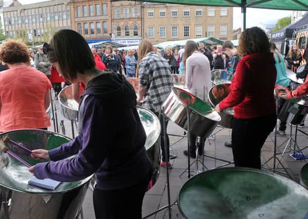 Mansfield Purple Flag event.              
Market Place crowds are entertained by the Notts Performing Arts County Steel Pan Band.