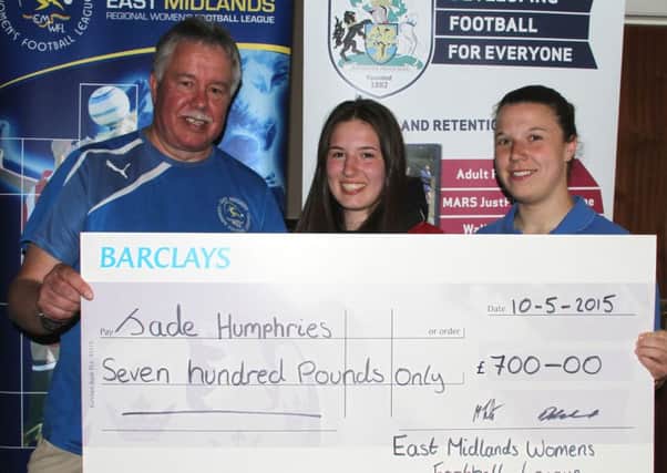Jade (centre) receives a cheque towards Orlando. Also pictured are league chairman Chris Roper and and Leanne Woodhead from the Notts FA.