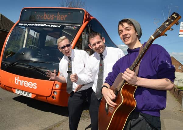 THE BUS BUSKER -- Warren Ireland with trentbarton drivers Lee Milne (left) and Allan Gilmour.