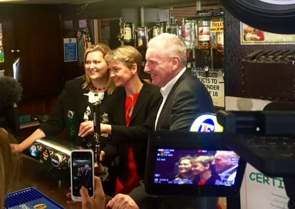 Léonie Mathers, Yvette Cooper MP and Vernon Coaker MP behind the bar at George Street Working Men's Club
