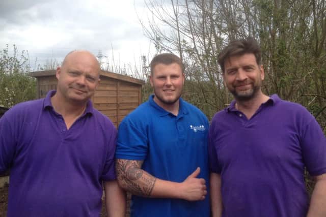 Jamie standing next to the DIY SOS team