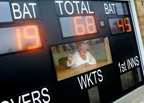 Marlene Hodgetts raises a glass of Mount Gay in memory of her husband Trevor, who was a former player for Mansfield Hosiery Mills Cricket Club and in whose memory Marlene funded a new scorebox and digital scoreboard. The new board displayed his year of birth, 1945 and his age when he died, being 68.