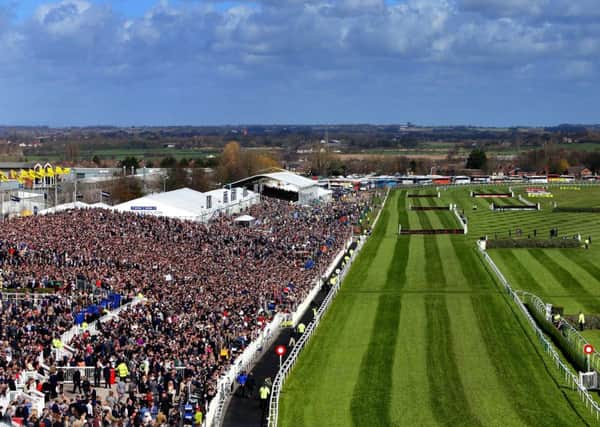 CROWD PLEASER -- huge crowds at Aintree's Grand National meeting in April helped to boost racing's attendance figures for the first half of the year (PHOTO BY: Peter Byrne/PA Wire).