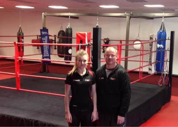 Kevin Henshaw with daughter, Amy, who is part of the coaching staff at the gym.