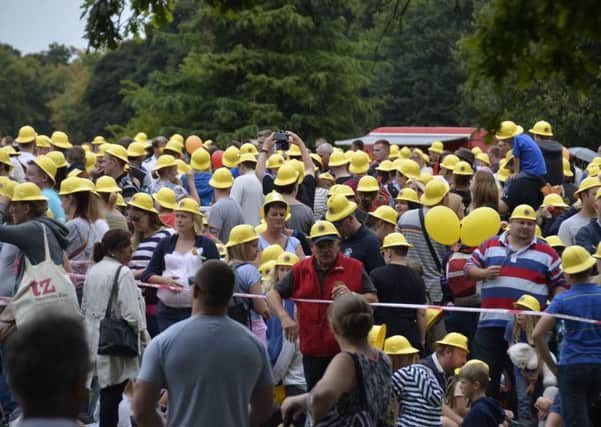 More than a thousand people wore firemen's helmets a 999 Emergency Services Day at Clumber Park.