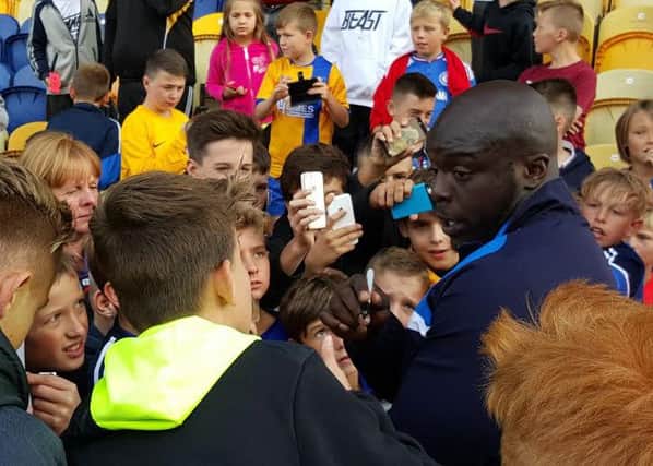 Ade Akinfenwa meets local youngsters at One Call Stadium after the game.