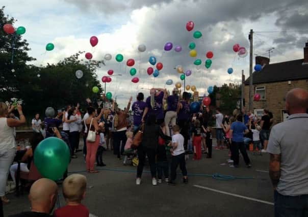 Friends of Sarah Redfern launched 150 balloons in her memory at  a fun day at Mansfield's Pop Inn to raise money for her memorial.