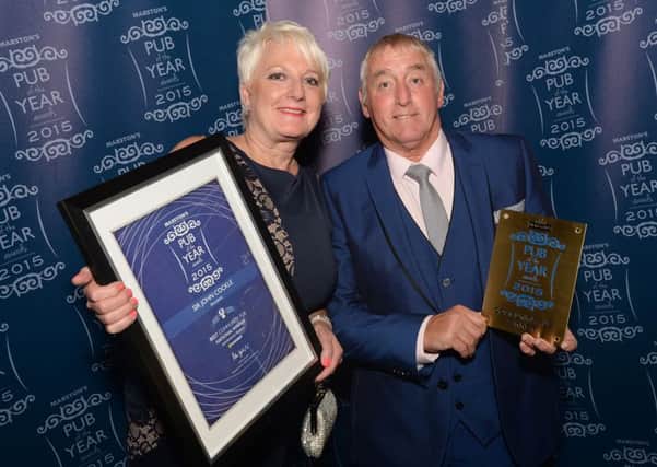 Licensees Elaine and Terry Pownall of the Sir John Cockle pub Mansfield, which won Marston's Community Pub of the year 2015.