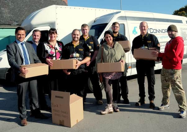 A campaign involving local firms &  the people of Mansfield has seen the donation of a load of items to help the Refugees both a Calais & at Airports
Sean O'Connor, boss of a local Removals company has offered to deliver the items to those in need.

NMAC 2-10-15  Refugee help, L/R Maria Higgins, Specer Preuett, Kate Ryan with some of the many bags of goods donated  (1)
NMAC 2-10-15  Refugee help, L/R Matthew Maiden of Bilton Hammond Solicitors, Spencer Preuett, Kate Ryan joint organiser of 'Mansfield Appeal for aid for Refugees', Kate is also from Whitegates Estate Agency, Sean O'Connor of Sean O'Connor & co removals, Aaron Waudby, Maria Higgins joint organiser also f Higgifit Lifestyles. Philip Needham & Allan Higgins  (2)