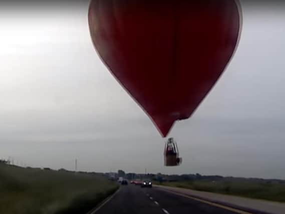 The balloon narrowly missed cars