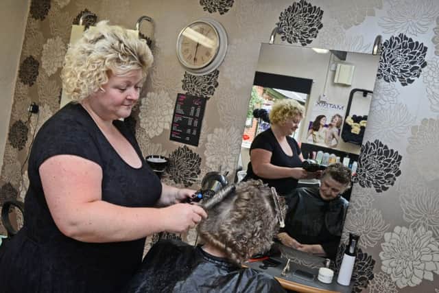 Julie Keeble, owner and hair stylist, pictured with a client at Glints Hair Salon. Picture: Marie Caley NEAA Workshop MC 6