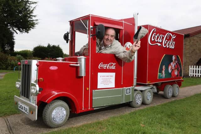 Barrie Hall, 73, pictured in his Coca Cola mobility scooter conversion, outside his home, in Lincoln.   Picture- RPY