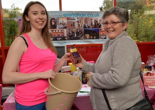 Breast cancer fundraising event at Hucknall Leisure Centre, Mary-Clare Endy recieves her tombola prize from Angela Benski