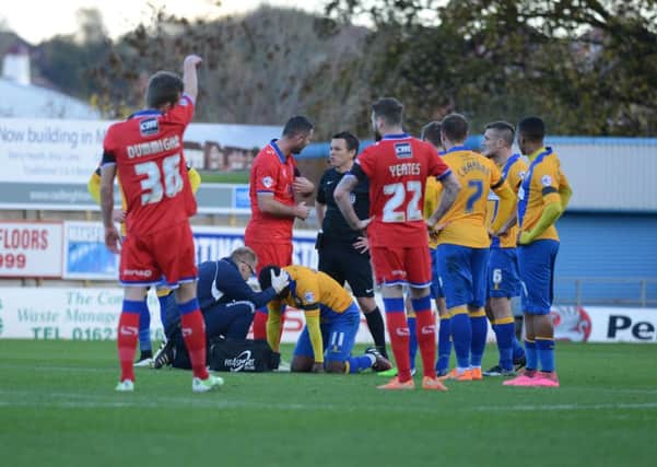 Mansfield Town v Oldham Athletic - FA Cup - One Call Stadium - Saturday 7th November 2015

Mansfield Towns Craig Westcarr No 11  Receives Treatment After A Hard Tackle