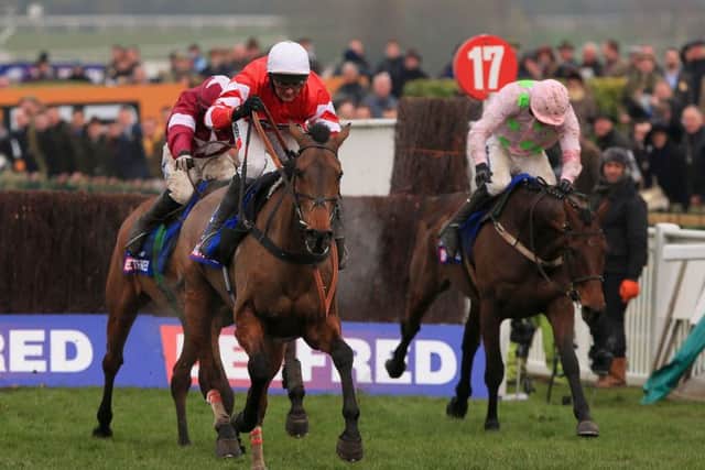 GOLDEN GLORY -- novice Coneygree fights off Djakadam (right) and Road To Riches to win the 2015 Cheltenham Gold Cup. (PHOTO BY: Nick Potts/PA Wire).