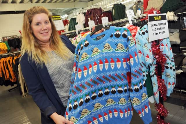 Lisa Bingley, Business Development Manager at Crystal Knitwear with some of their Christmas jumper designs.