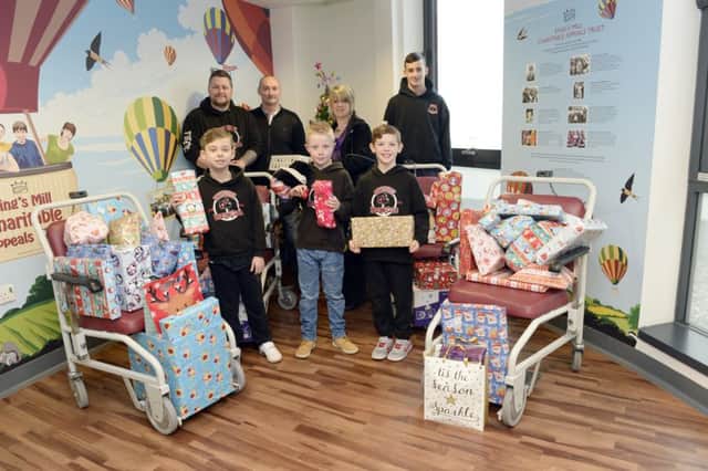Empire Boxing Club have been helping the family of the late Corah Slaney deliver presents to the Childrenâ¬"s Ward at Kings Mill Hospital, Sutton-in-Ashfield. Corahâ¬"s parents Lisa and Carl with the presents and members of the club