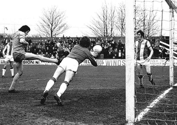Ernie Moss in action for Mansfield Town.