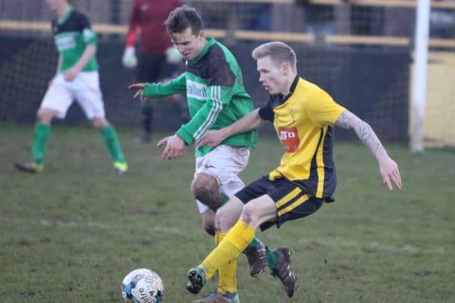 ACTION from Belper United's 4-1 defeat at Hucknall Town.