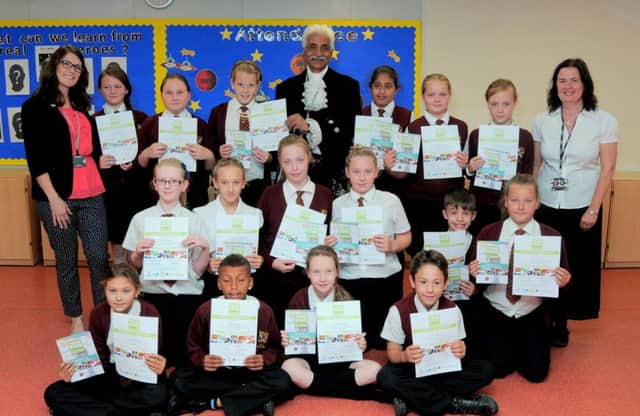 Dr Jas Bilkhu, High Sheriff of Notts, with pupils from Worksop Priory School pic provided by Simon Redfern of Notts county council press office