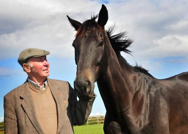 GOING FOR GLORY AGAIN -- owner Trevor Hemmings with Many Clouds after their Grand National triumph in 2015. The nine-year-old has been allocated top weight for this year's race.