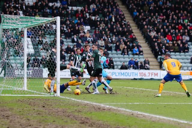 Goal mouth scramble - Pic Chris Holloway - The Bigger Picture