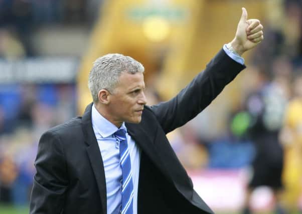 Ex-Mansfield Town boss Keith Curle gives a thumbs up to the home crowd after receiving a round of applause -Pic by: Richard Parkes