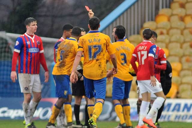 Referee Sebastian Stockbridge sends off Krystian Pearce and gives the penalty. Photographer Steve Uttley.