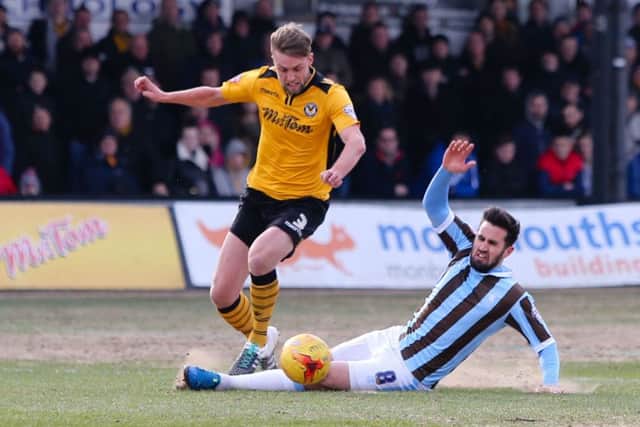 Mansfield Town's Chris Clements gets the tackle in - Pic Chris Holloway