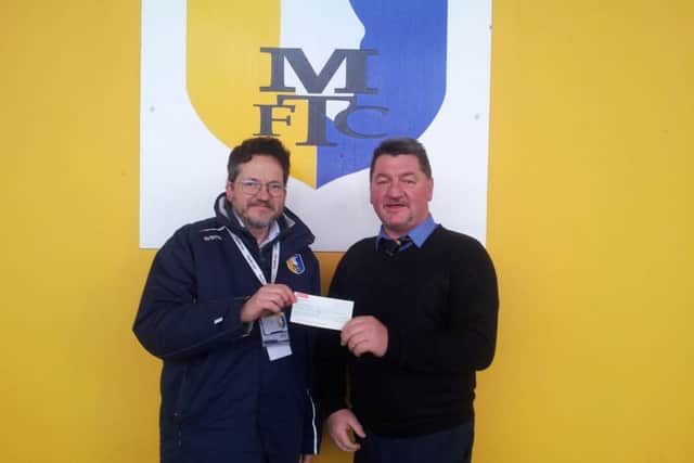 Martin Shaw presents the cheque to Steve Hymas.