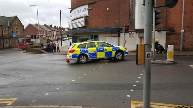 An eyewitness took this picture of the car on top of the bollard.