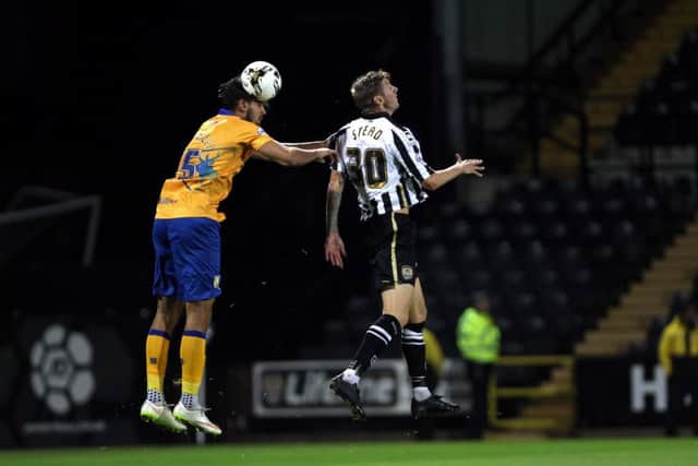Notts County v Mansfield Town
English League Football - Sky Bet League Two
Meadow Lane Stadium, Nottingham, England.
14th August 2015

Mansfield Town's Ryan Tafazolli heads clear from Notts County's Jon Stead.

Picture by Dan Westwell