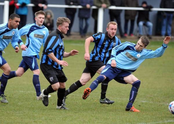 Bulwell (in light blue) are pictured in action at Selston on Saturday. Photo by Anne Shelley.