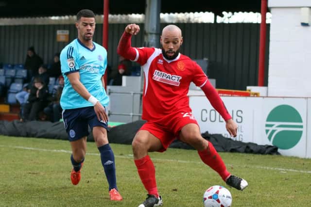 Alfretons Karl Hawley whips in a dangerous cross.