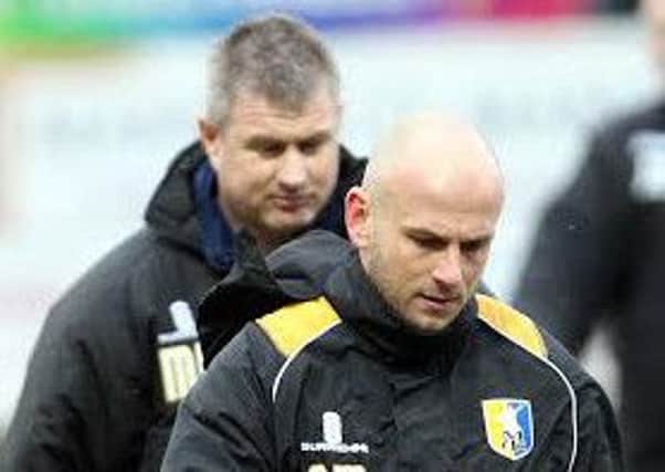 Mansfield Town manager Adam Murray with assistant Micky Moore behind.
Picture by Dan Westwell