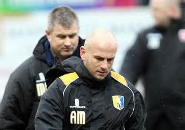 Mansfield Town manager Adam Murray with former coach Micky Moore behind.
Picture by Dan Westwell